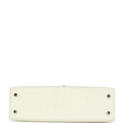 White mini Kelly-style handbag base with four small metal feet