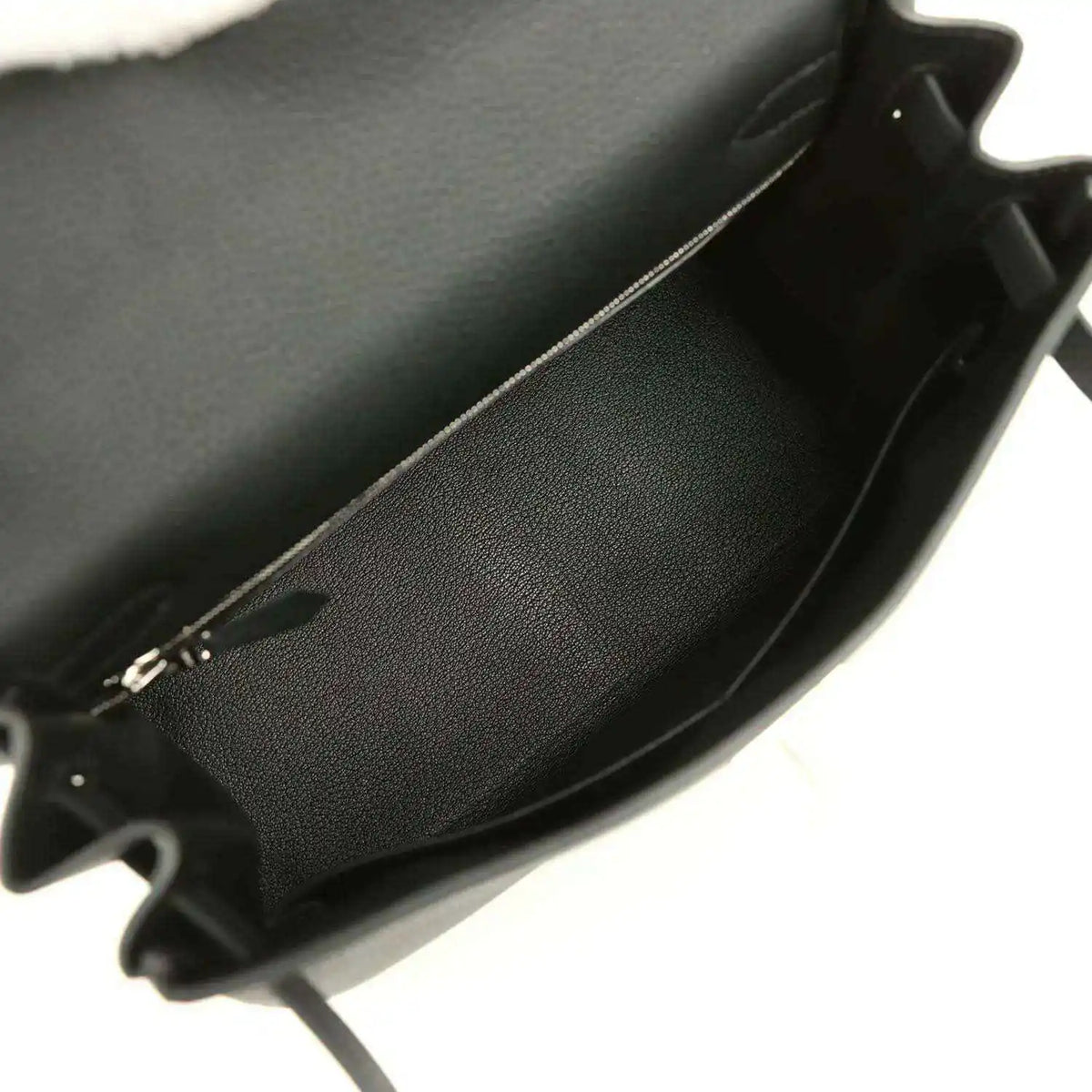 Black leather Kelly bag interior with smooth lining and open edge