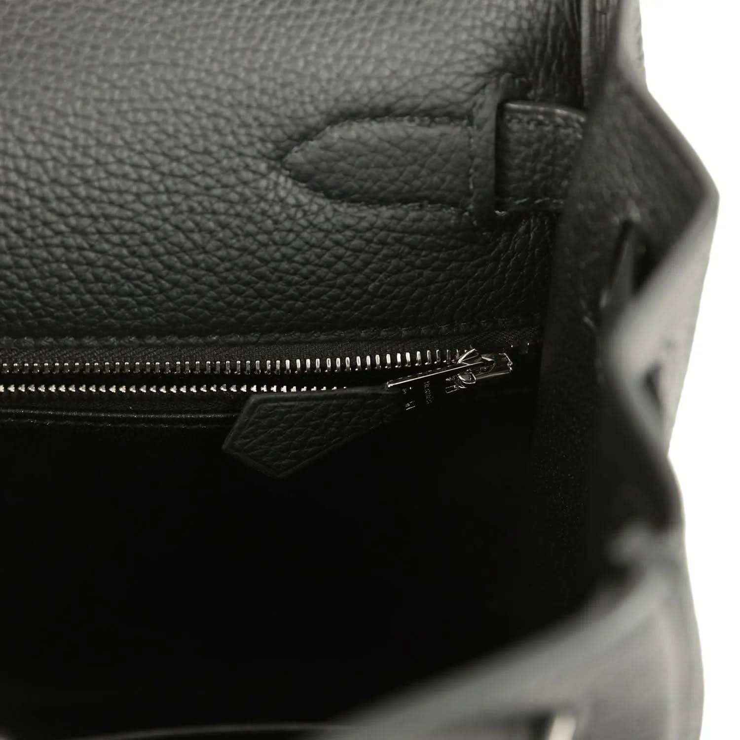 Black leather Kelly bag interior with zipper closure and metal pull