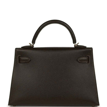 Dark leather mini top-handle bag with stitched panel and two front pockets
