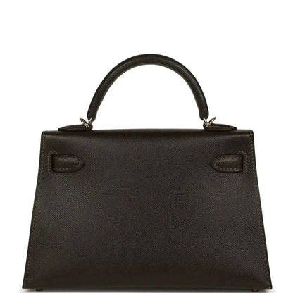 Dark leather mini top-handle bag with stitched panel and two front pockets