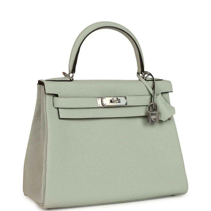 Hermes Kelly Retourne 28 bag with front flap, palladium-tone turnlock, and adjustable strap
