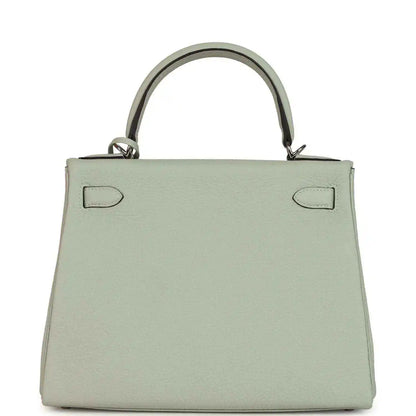Hermes Kelly Retourne 28 bag front view with flap closure and two strap tabs