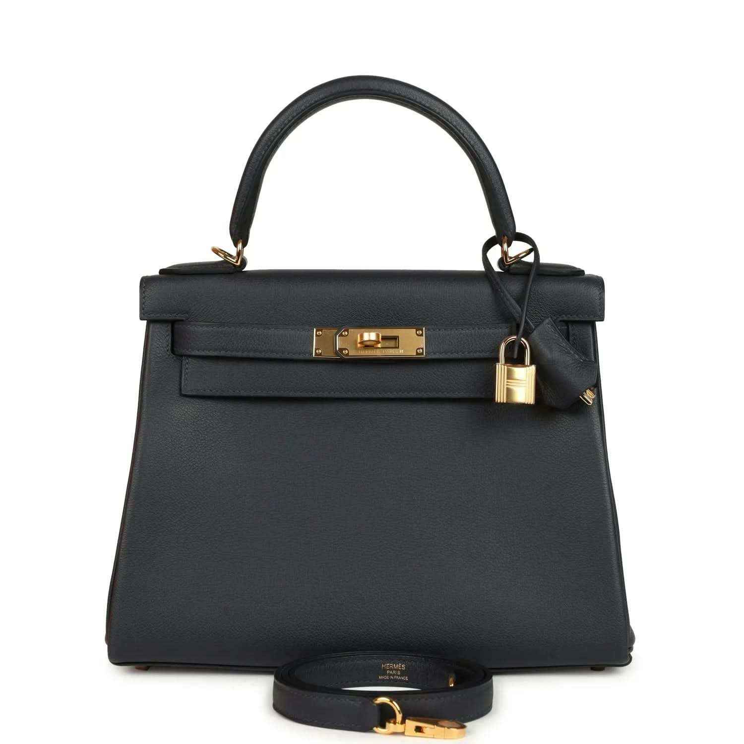 Hermes Kelly Retourne 28 handbag, dark navy leather, gold turn-lock, top handle.