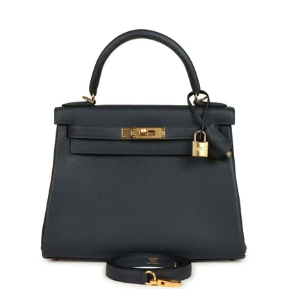 Hermes Kelly Retourne 28 handbag, dark navy leather, gold turn-lock, top handle.