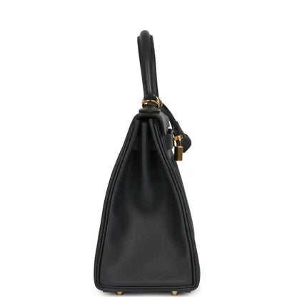 Hermes Kelly Retourne 28 handbag back, dark navy leather, top handle loop, gold feet.
