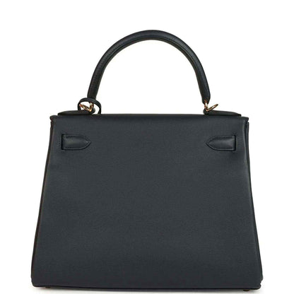 Hermes Kelly Retourne 28 handbag front, dark navy leather, structured shape, top handles.