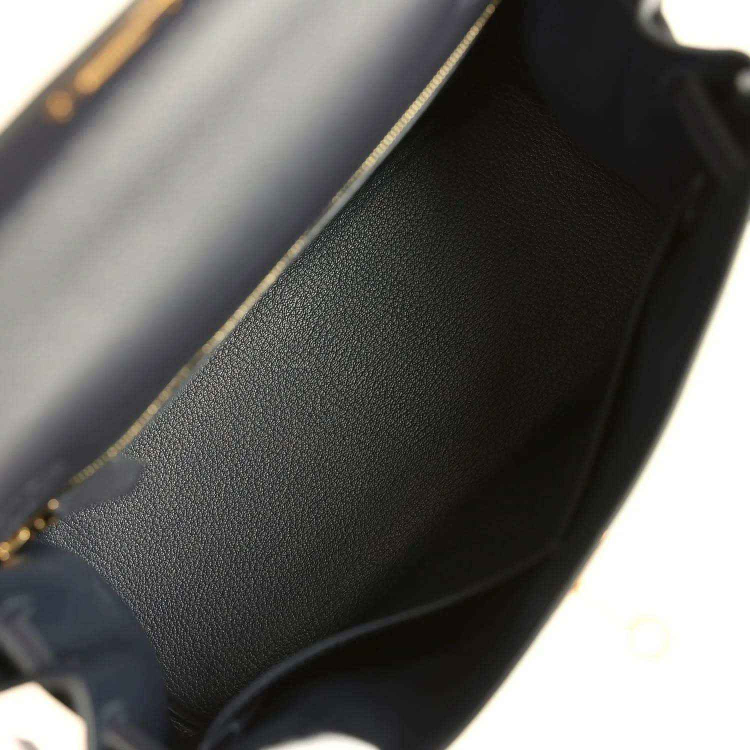 Hermes Kelly Retourne 28 handbag interior, dark leather lining with pebble grain.