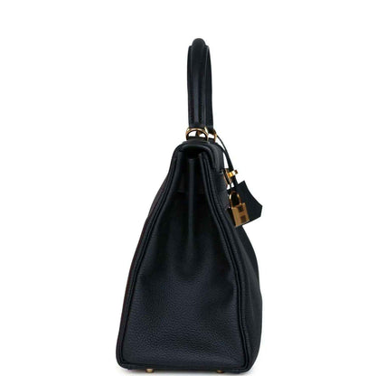 Hermes Kelly Retourne 28 handbag, black leather side view with gold padlock and handle