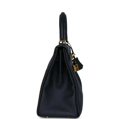 Hermes Kelly Retourne 28 handbag, black leather side view with gold padlock and handle