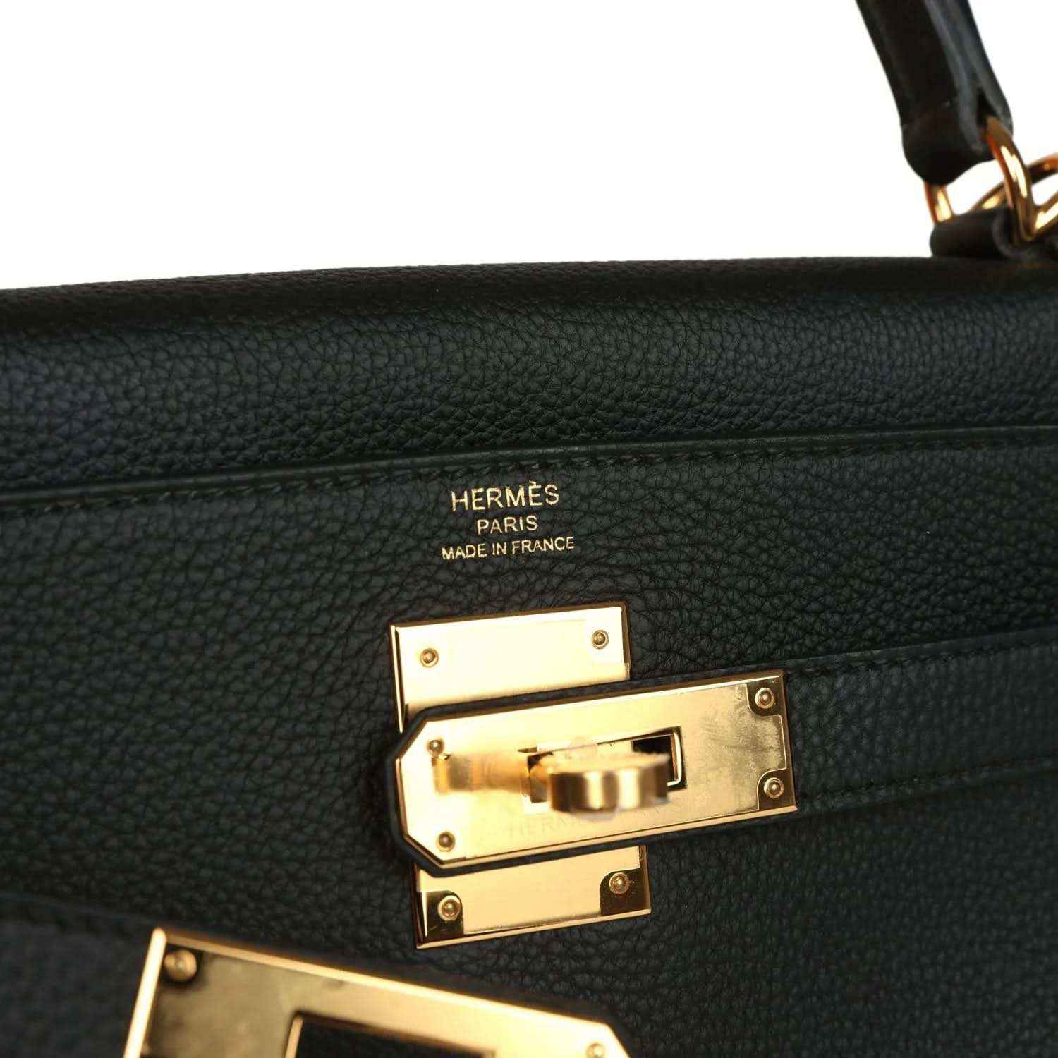 Hermes Kelly Retourne handbag detail, gold turnlock hardware with Hermes Paris markings