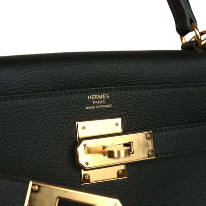 Hermes Kelly Retourne handbag detail, gold turnlock hardware with Hermes Paris markings