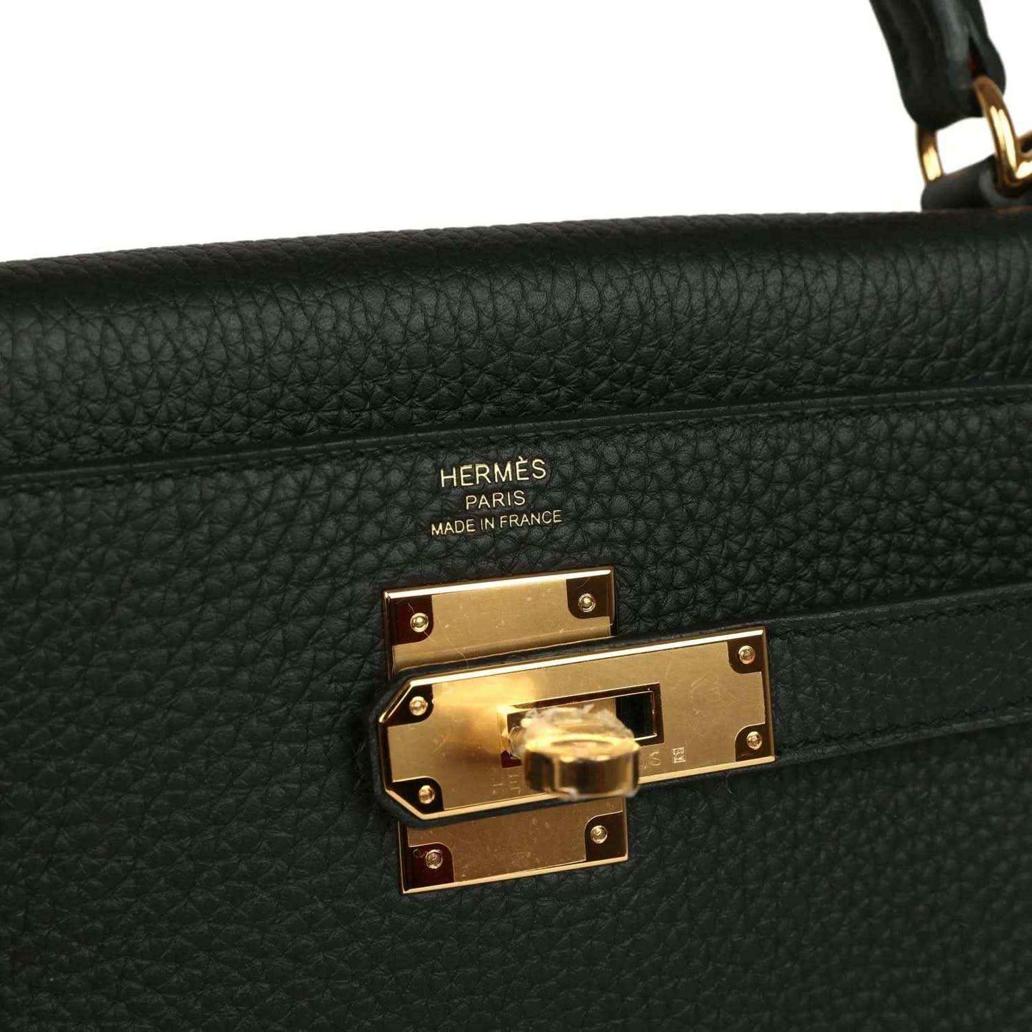 Hermes Kelly Retourne 28 black leather flap clasp with gold-tone lock hardware and Hermes logo