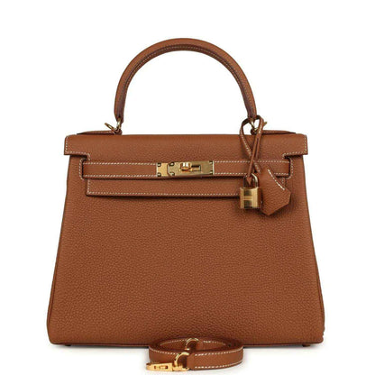 Leather handbag in tan brown with top handles and gold-tone front lock hardware