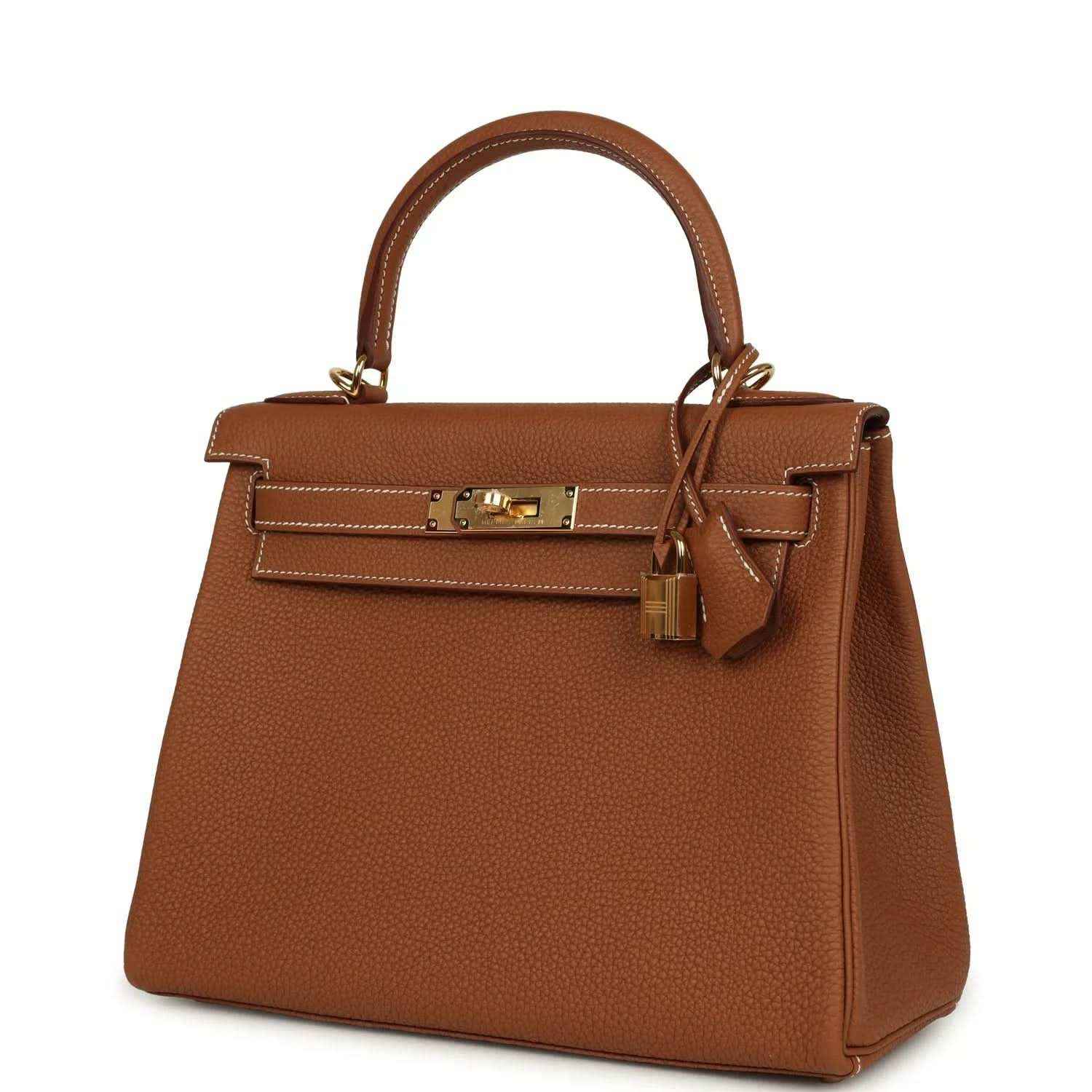 Tan brown leather Kelly-style handbag with top handle and gold-tone front closure