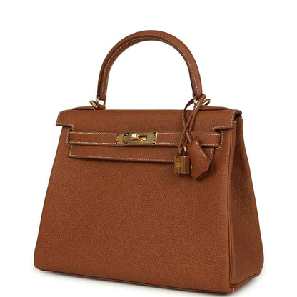Tan brown leather Kelly-style handbag with top handle and gold-tone front closure