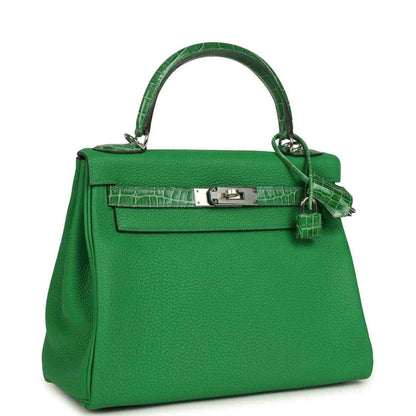 Green leather handbag with croc-pattern flap, front lock plate, and shoulder strap