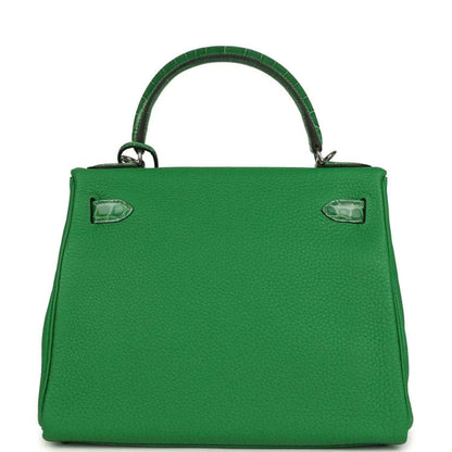 Green leather handbag front panel with corner details and embossed texture