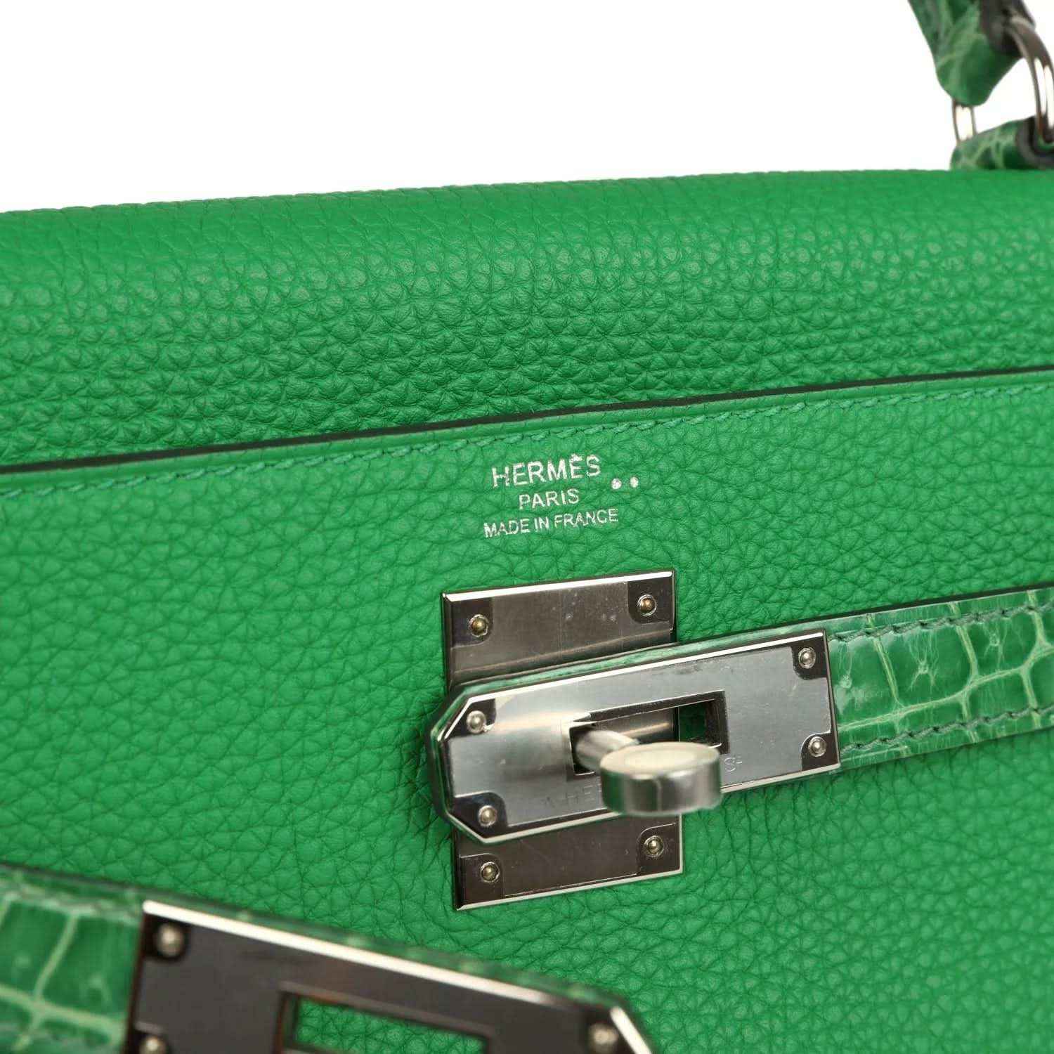 Hermes green leather flap clasp with metal lock and croc-pattern trim