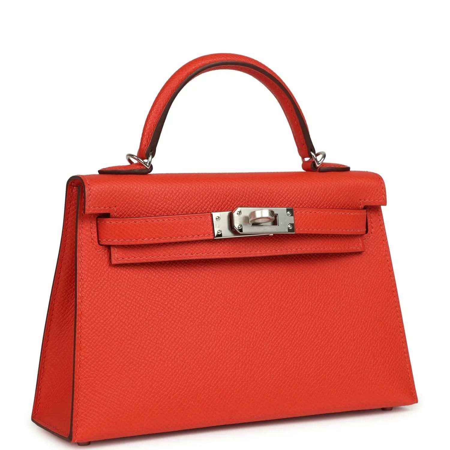Red mini Kelly top-handle bag with front flap and silver-tone lock hardware