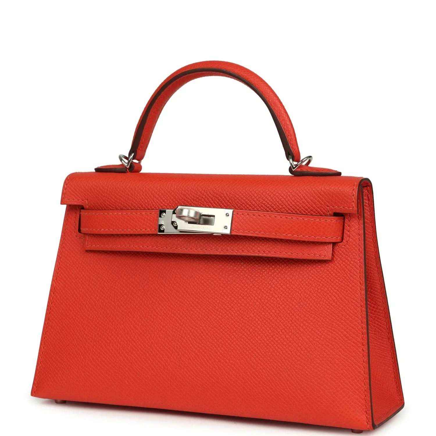 Red mini Kelly top-handle bag front view with flap clasp and silver-tone hardware