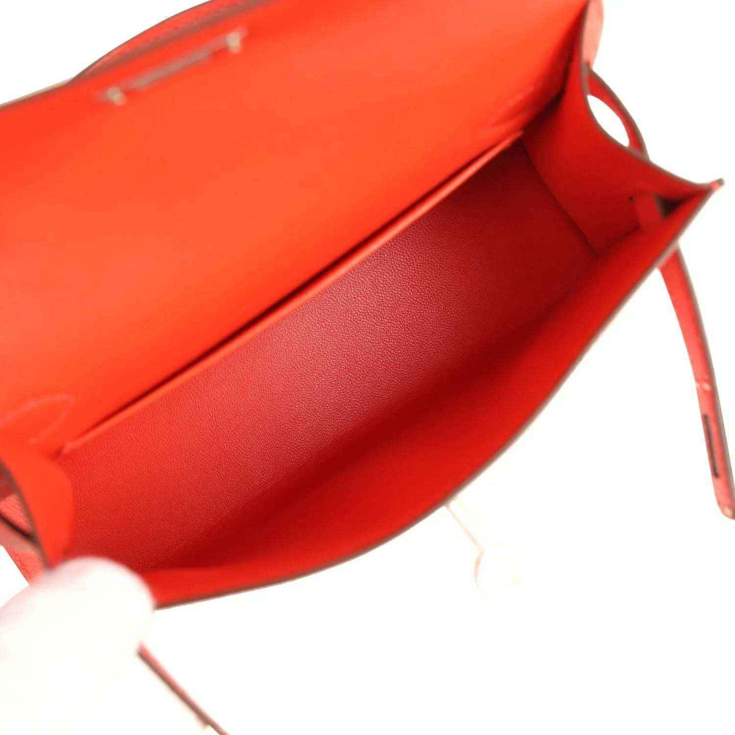 Red mini bag interior view with flap opening and smooth lining