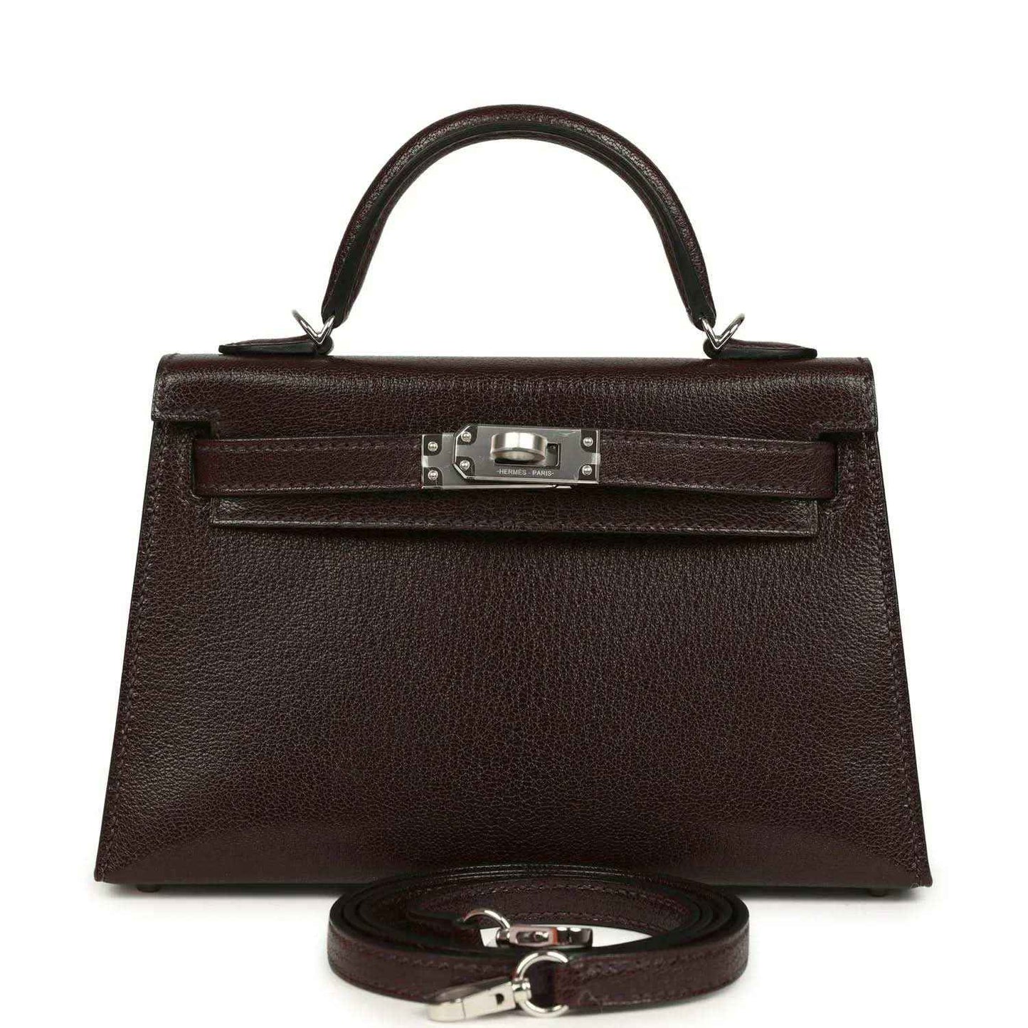 Small leather handbag with front flap, silver-tone clasp, and matching strap