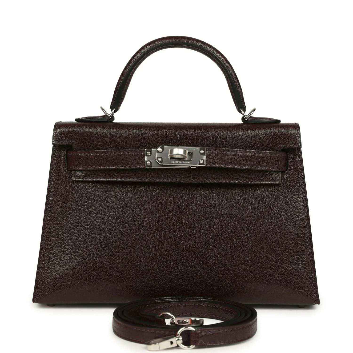 Small leather handbag with front flap, silver-tone clasp, and matching strap