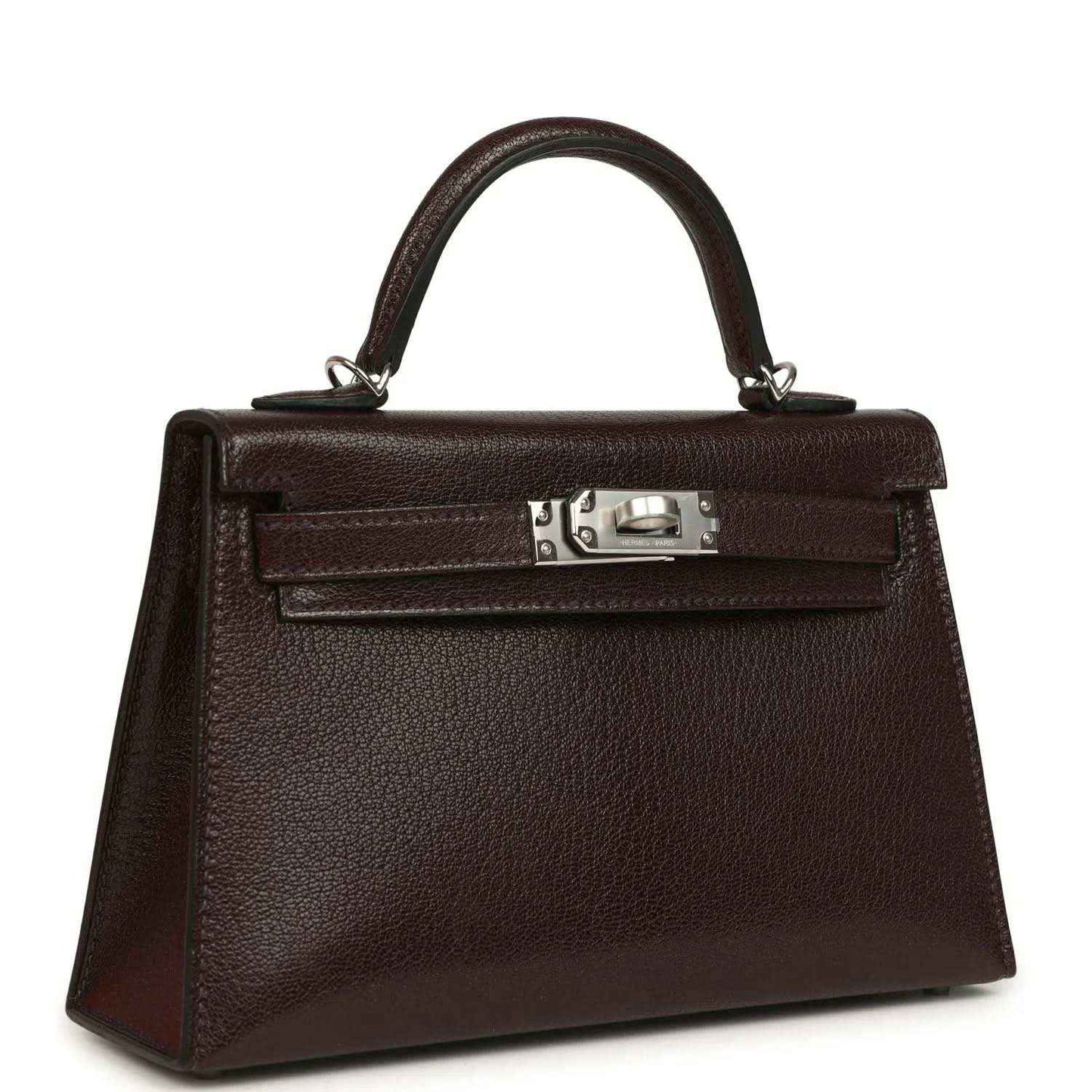 Small leather handbag with top handle, front flap, and silver-tone clasp