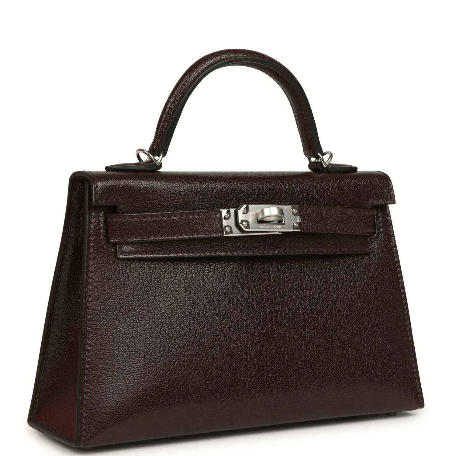 Small leather handbag with top handle, front flap, and silver-tone clasp