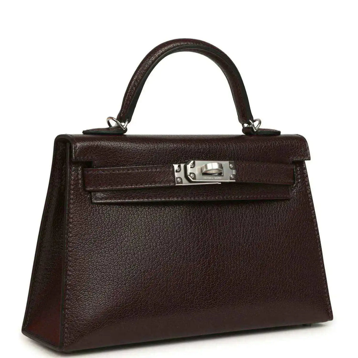 Small leather handbag with top handle, front flap, and silver-tone clasp