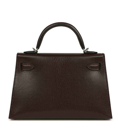 Small leather handbag back with top handle and stitched decorative tabs