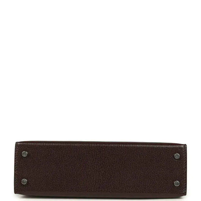 Small leather handbag bottom with metal feet and reinforced corners