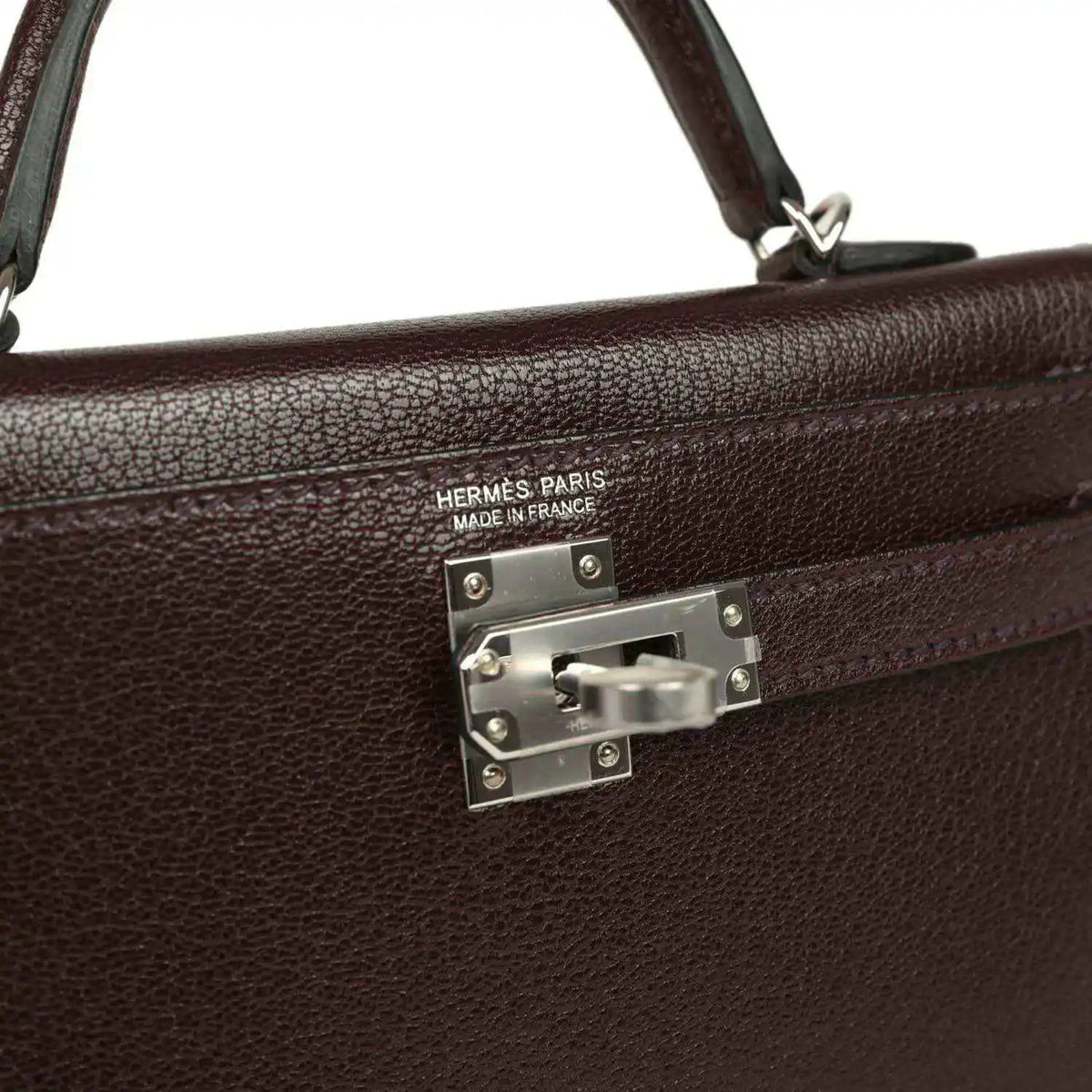 Hermès Paris handbag front clasp with engraved logo and metal plate