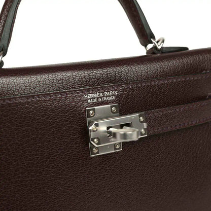 Hermès Paris handbag front clasp with engraved logo and metal plate