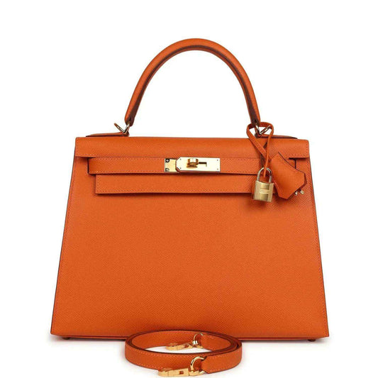 Orange leather Kelly bag with gold hardware, top handle and detachable shoulder strap.