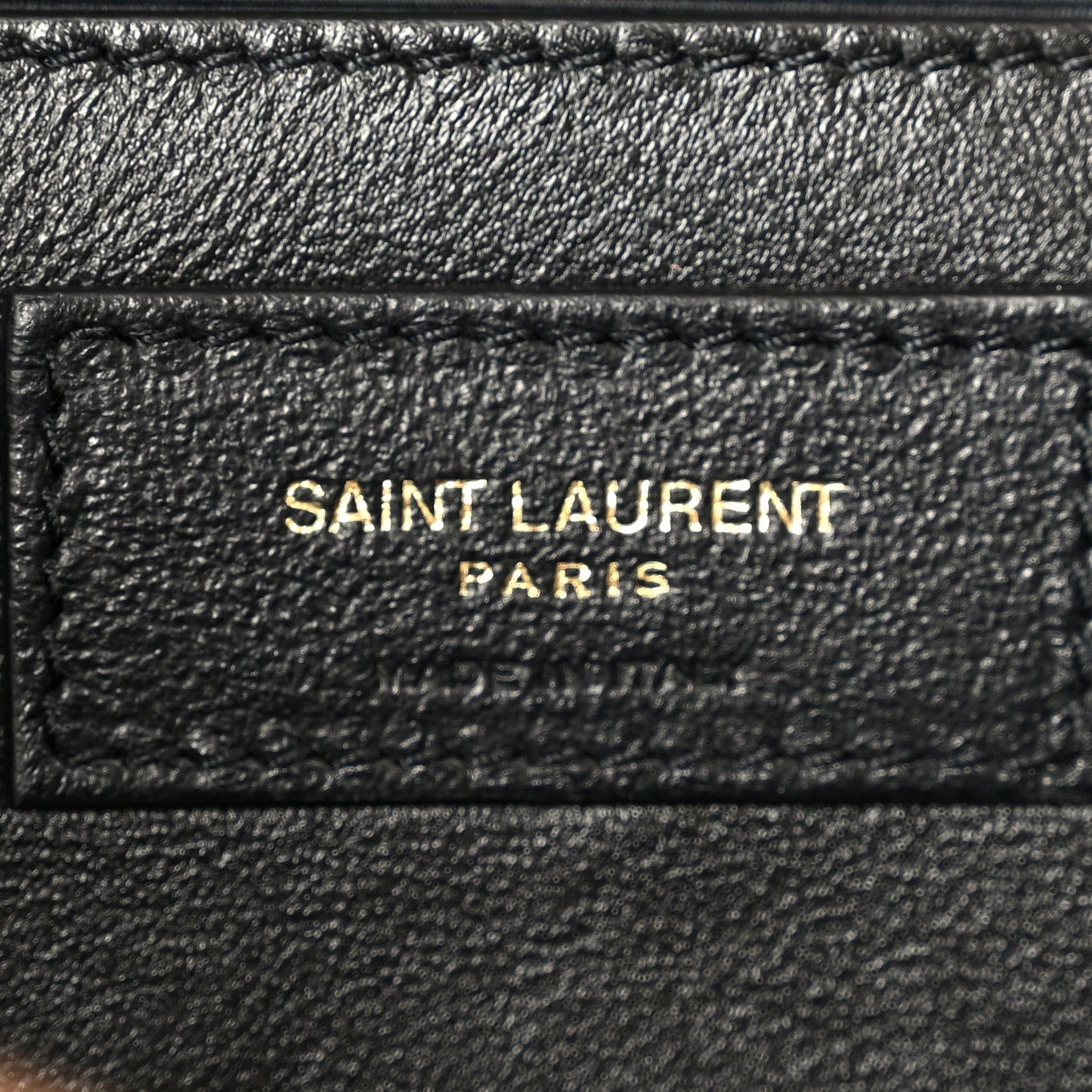 Black leather inner patch with 'SAINT LAURENT PARIS' text