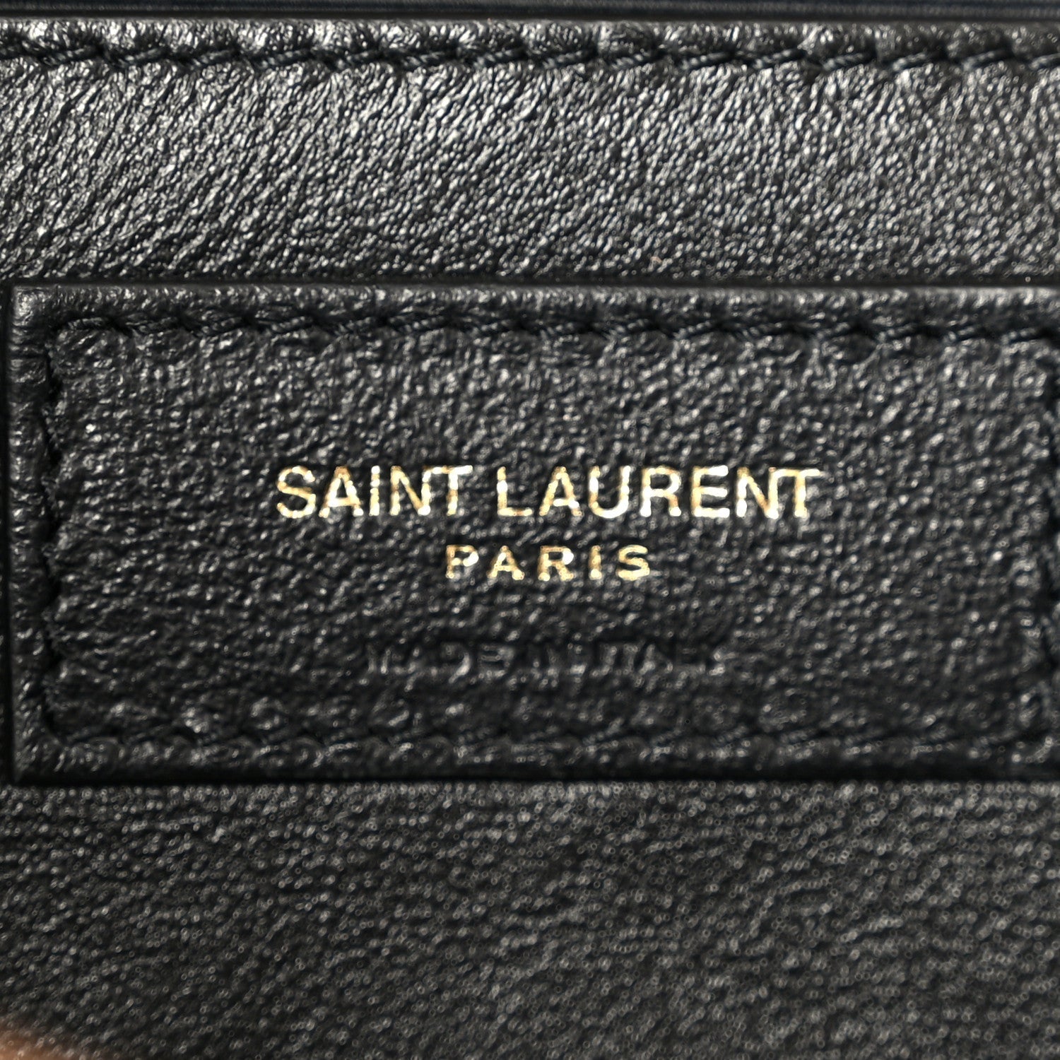 Black leather inner patch with 'SAINT LAURENT PARIS' text