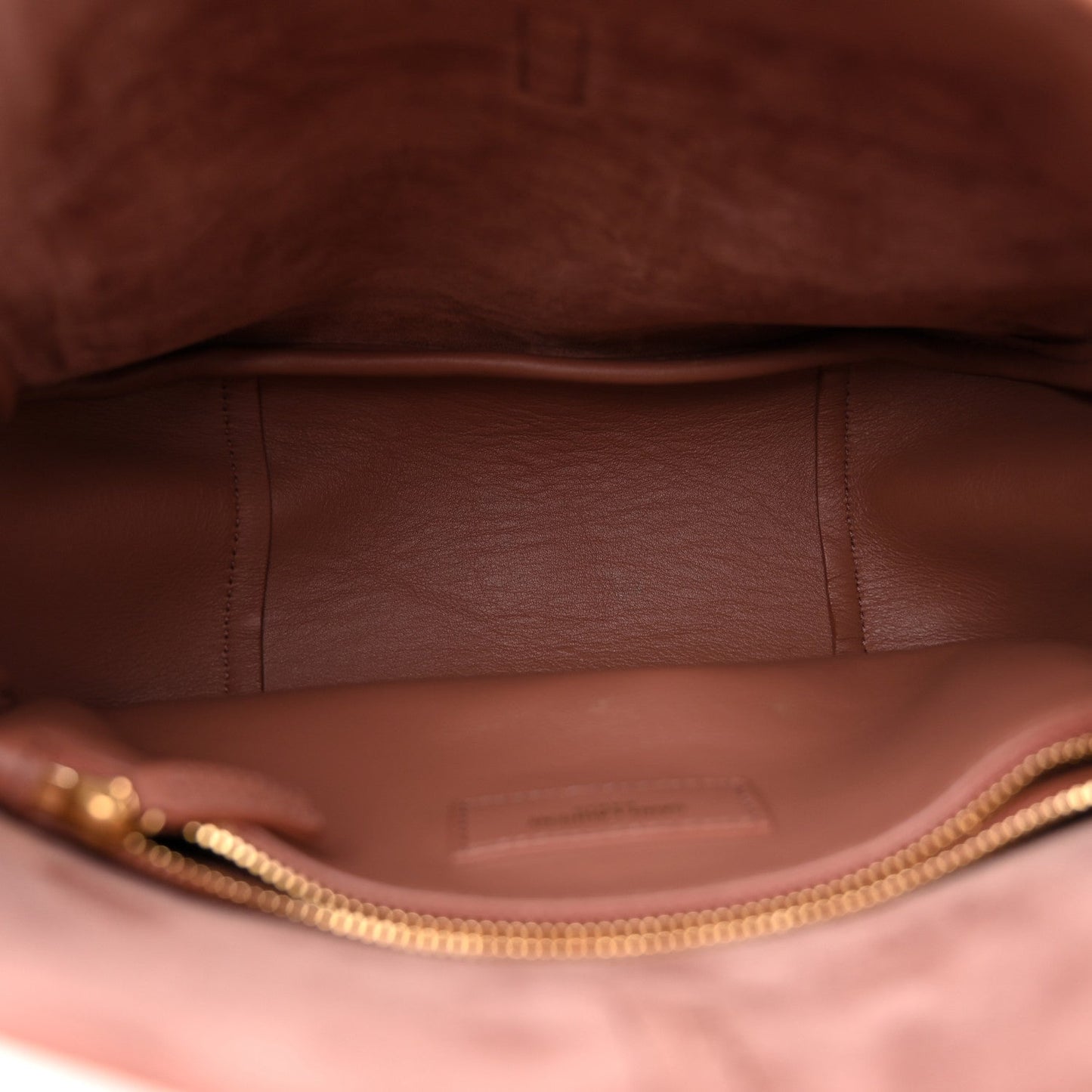 Small suede hobo bag interior with fabric lining and gold-tone zipper