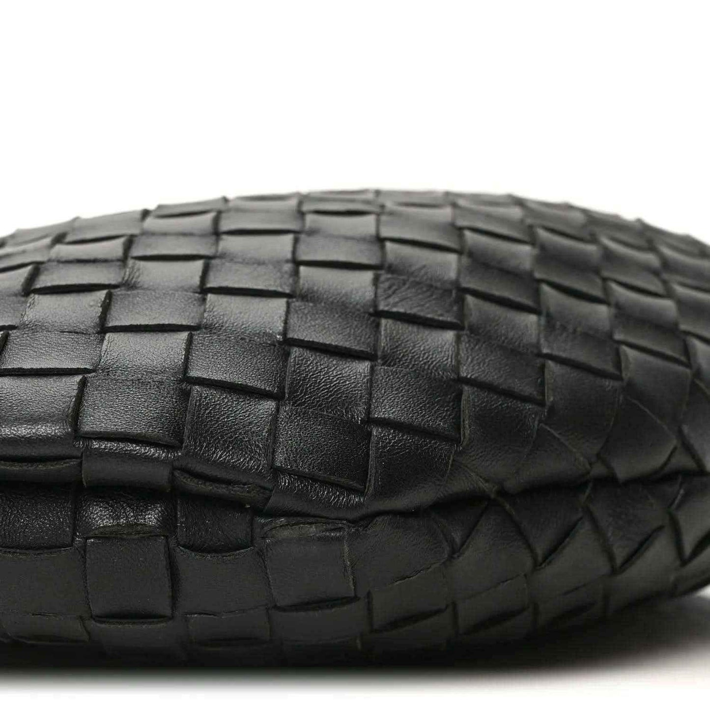 Bottega Veneta intrecciato nappa bag side in black with woven pattern close-up.