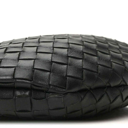 Bottega Veneta intrecciato nappa bag side in black with woven pattern close-up.