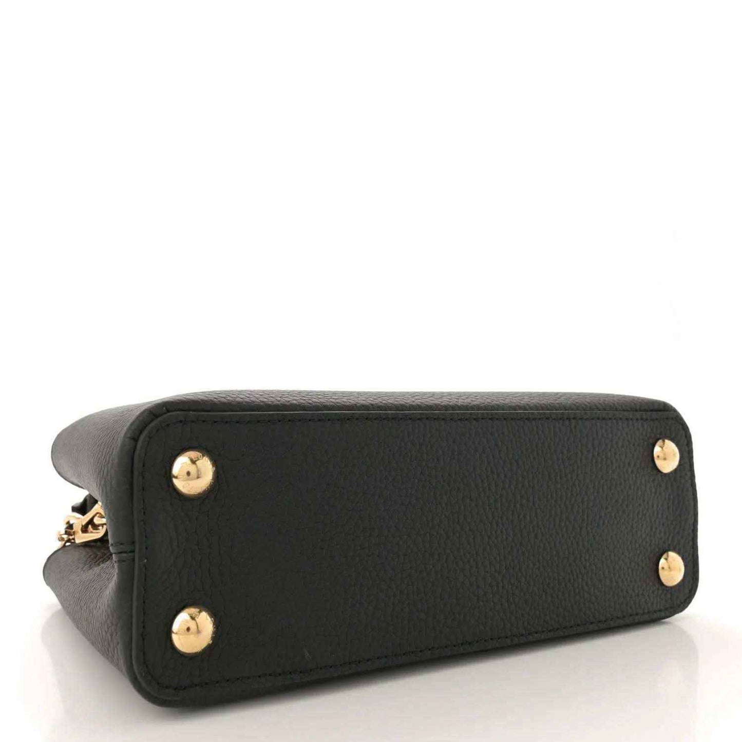 Black leather bag with gold stud feet on base corners, side view