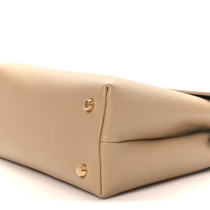 Beige Nino safari bag corner with gold stud feet and leather panel