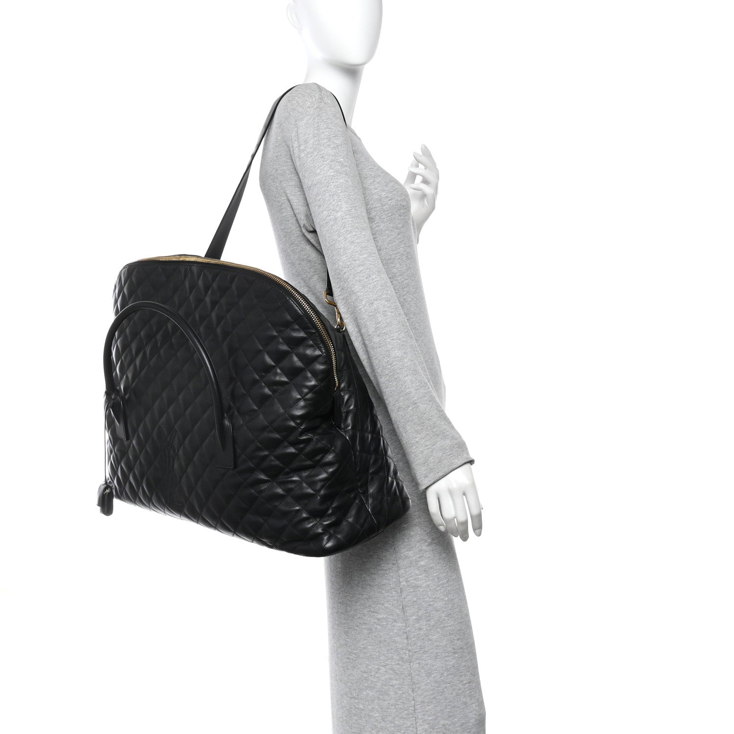 Saint Laurent ES quilted travel bag in black leather, side view with shoulder strap.