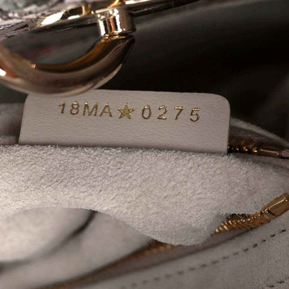 Handbag interior style tag reading 18MA★0275 under stitched lining