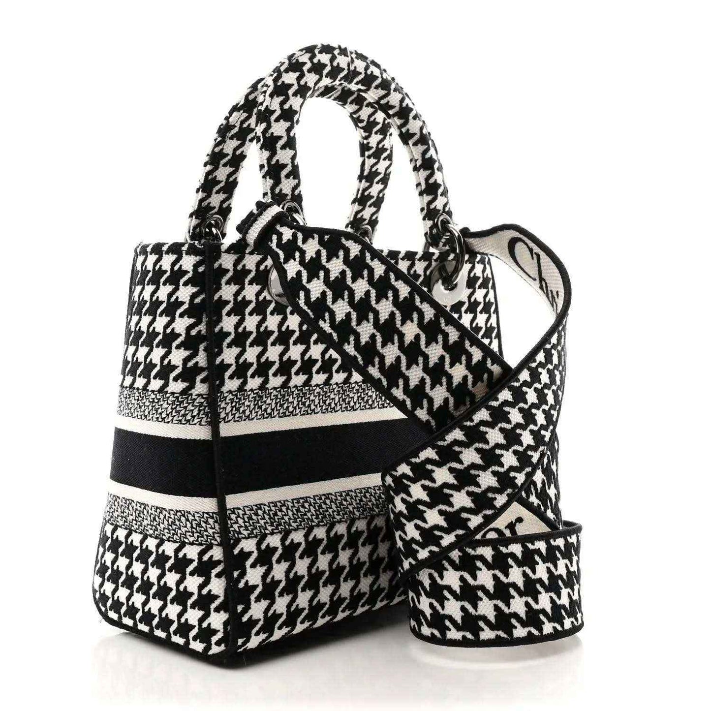 Black-and-white houndstooth canvas bag with top handle and shoulder strap