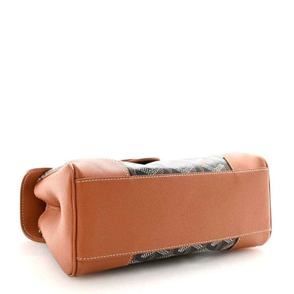 Mini Saigon shoulder bag underside, tan leather base with dark patterned side trim