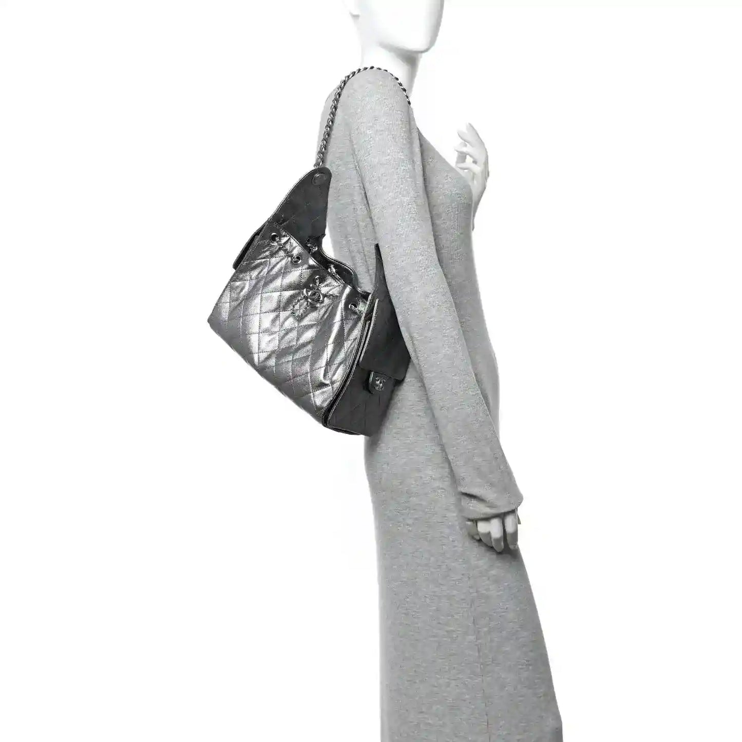 Chanel metallic caviar quilted handbag with chain strap, worn at side