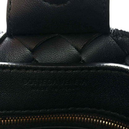 Black leather zipper opening with quilted weave detail