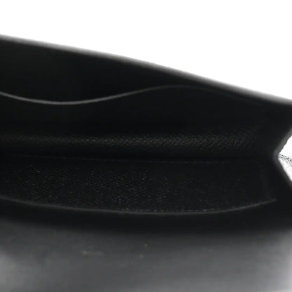 Black leather wallet interior with stitched edge and soft lining.